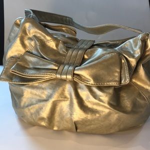 NWOT New York & Company Gold Leather Bow Bag